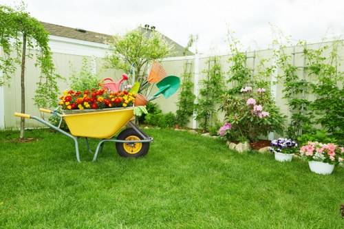 Gardener pruning shrubs in a Knightsbridge courtyard